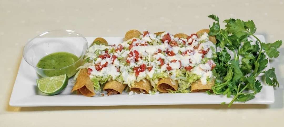 Crispy flautas with crema and queso fresco