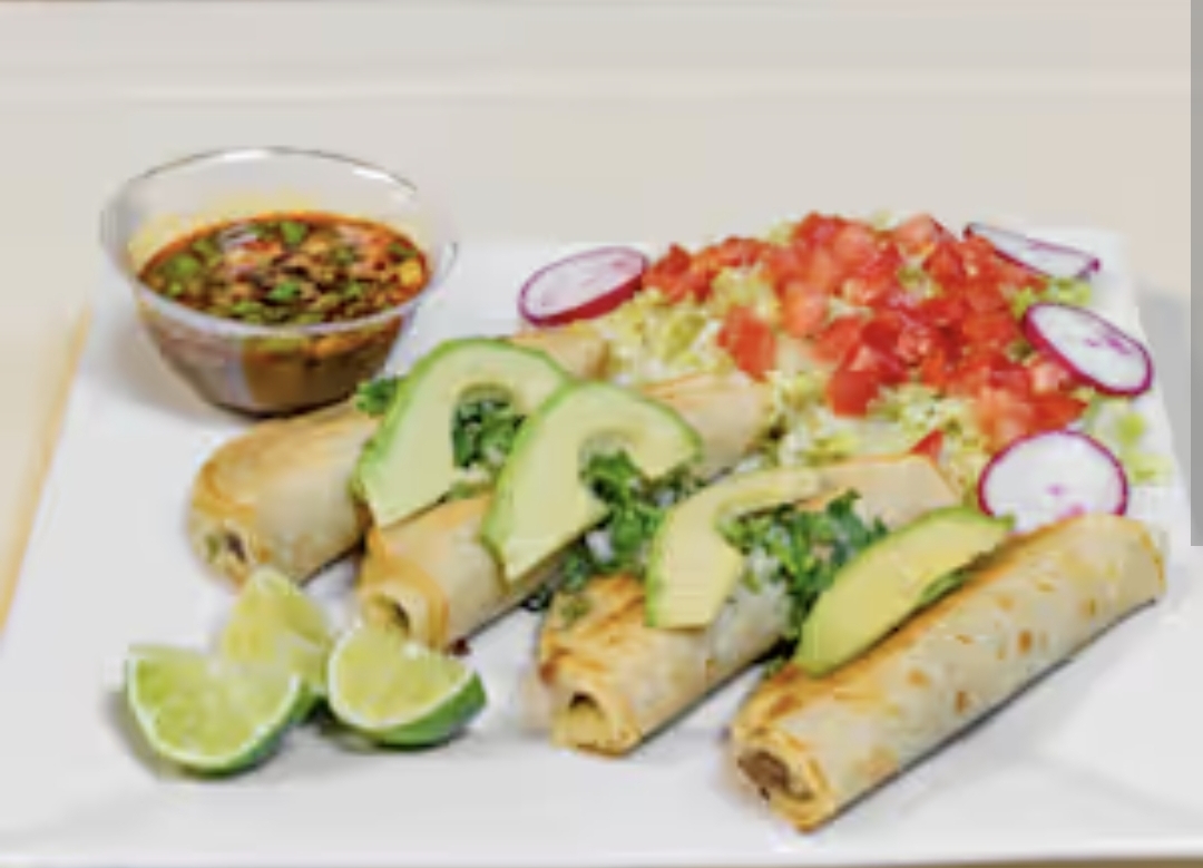 Flautas plated with avocado slices, pico de gallo, radishes and salsa